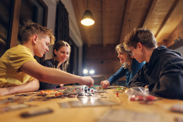 Adults playing strategic board games for creativity and learning